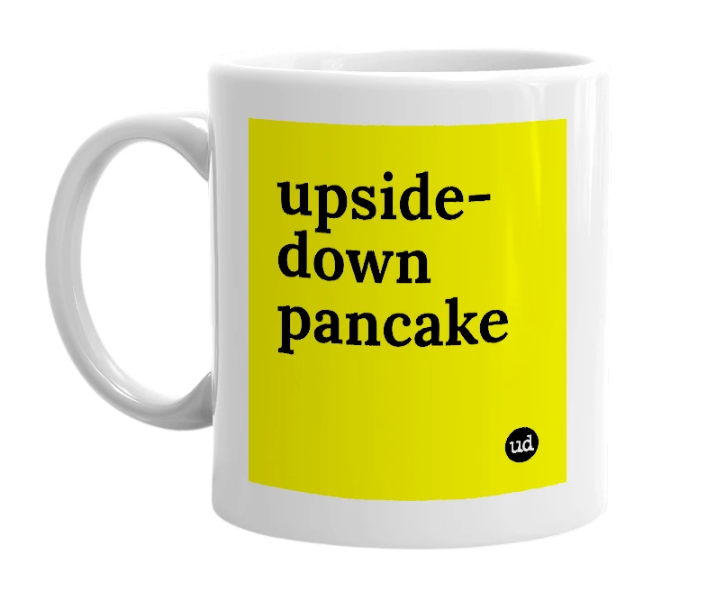 White mug with 'upside-down pancake' in bold black letters