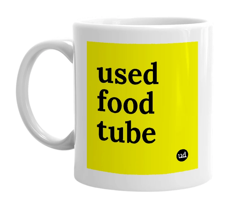 White mug with 'used food tube' in bold black letters