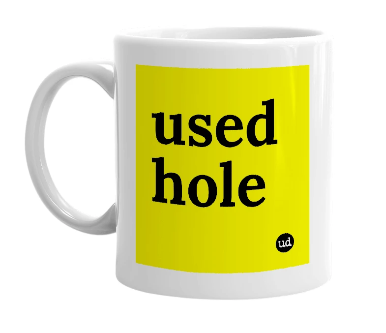 White mug with 'used hole' in bold black letters