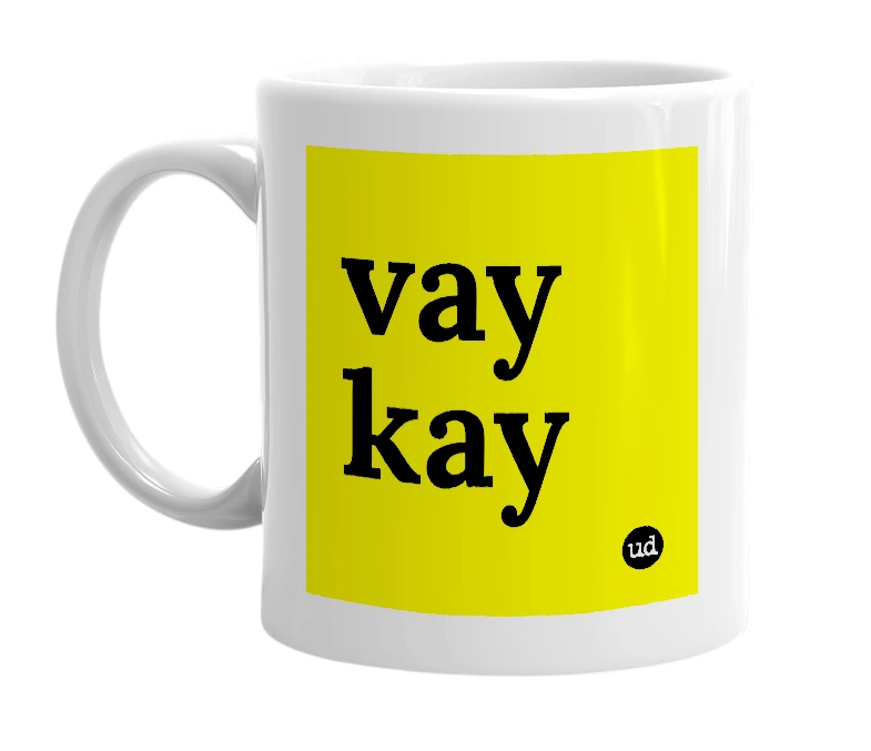 White mug with 'vay kay' in bold black letters