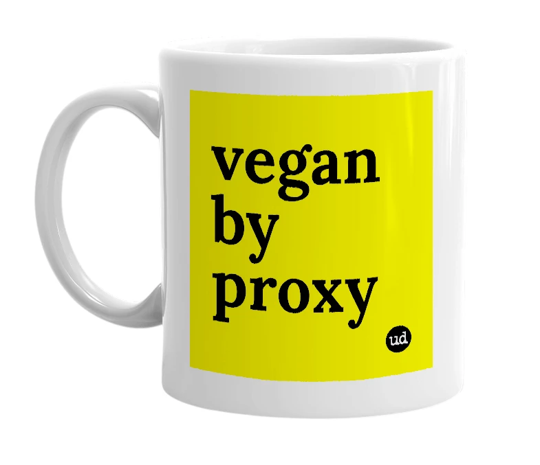 White mug with 'vegan by proxy' in bold black letters