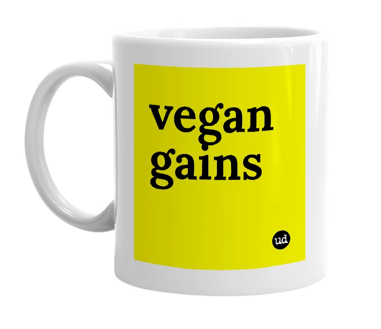 White mug with 'vegan gains' in bold black letters