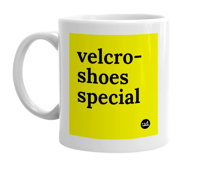 White mug with 'velcro-shoes special' in bold black letters