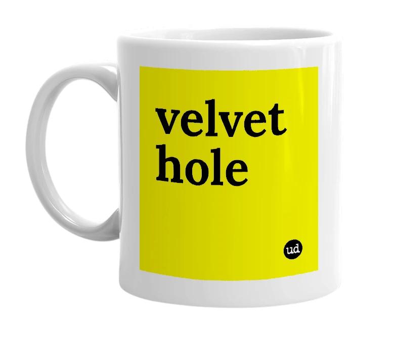 White mug with 'velvet hole' in bold black letters