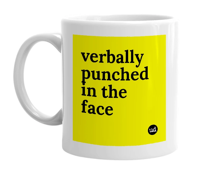 White mug with 'verbally punched in the face' in bold black letters