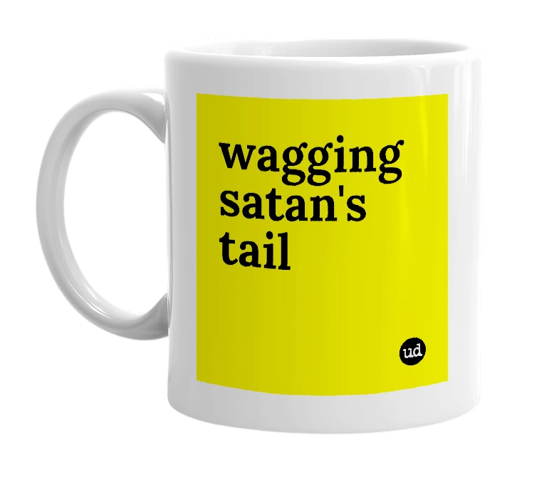 White mug with 'wagging satan's tail' in bold black letters