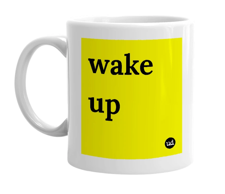 White mug with 'wake up' in bold black letters