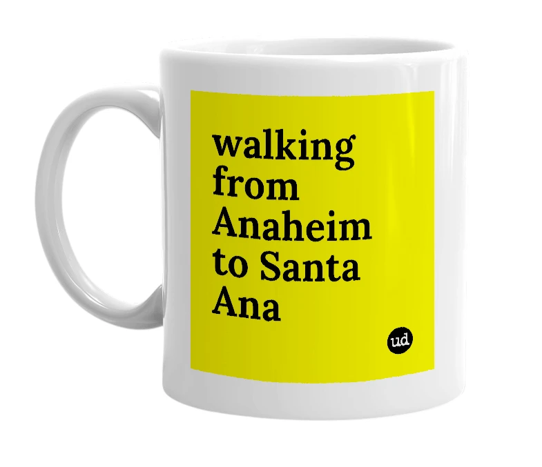 White mug with 'walking from Anaheim to Santa Ana' in bold black letters