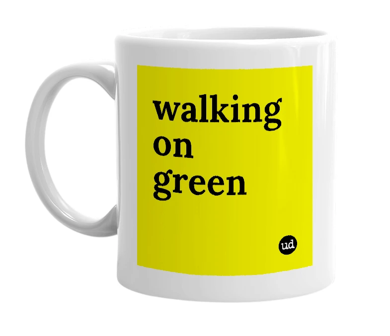 White mug with 'walking on green' in bold black letters