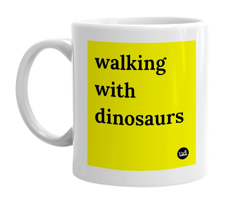 White mug with 'walking with dinosaurs' in bold black letters
