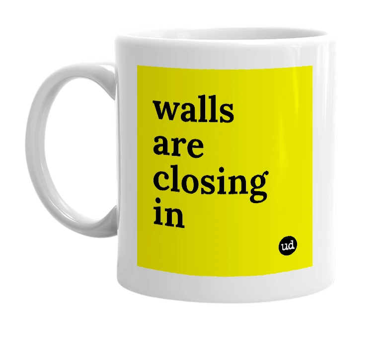 White mug with 'walls are closing in' in bold black letters