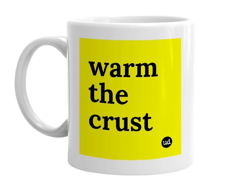 White mug with 'warm the crust' in bold black letters