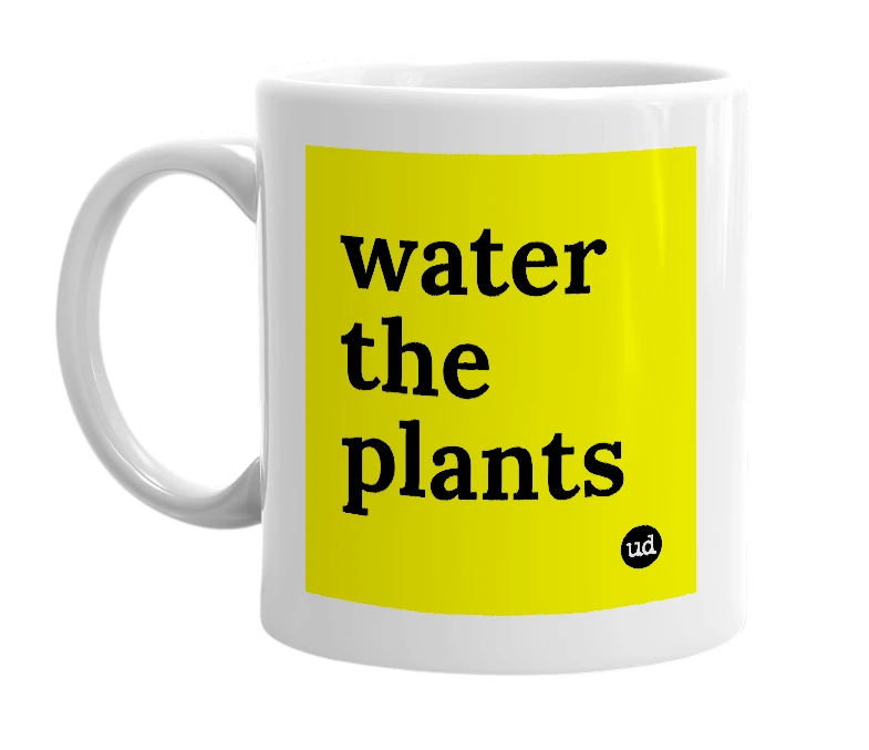 White mug with 'water the plants' in bold black letters