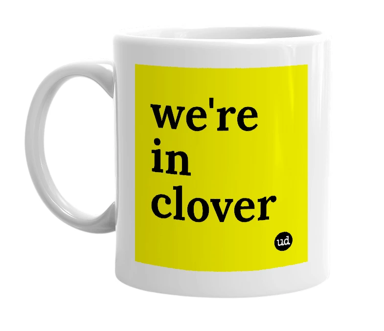 White mug with 'we're in clover' in bold black letters