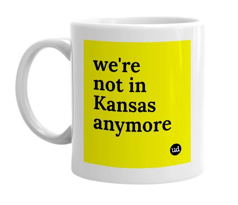 White mug with 'we're not in Kansas anymore' in bold black letters