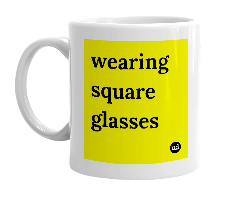 White mug with 'wearing square glasses' in bold black letters