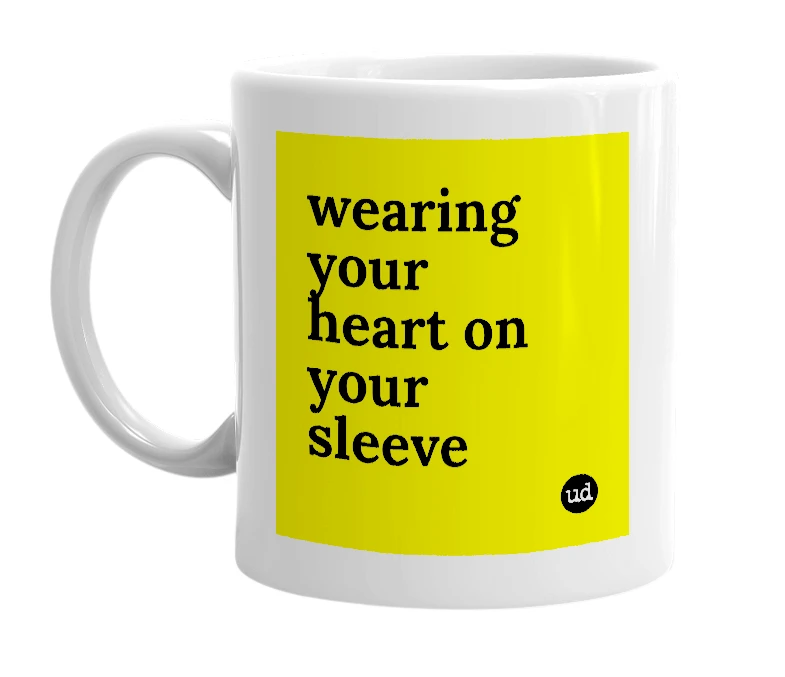 White mug with 'wearing your heart on your sleeve' in bold black letters