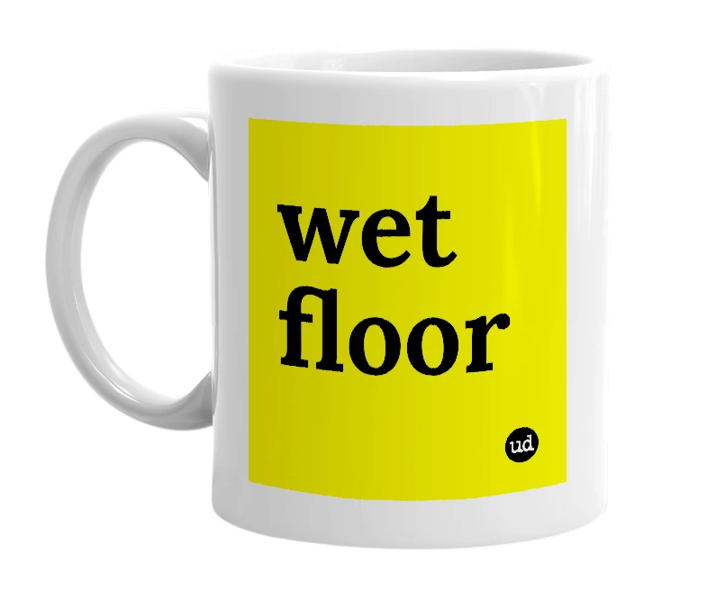 White mug with 'wet floor' in bold black letters