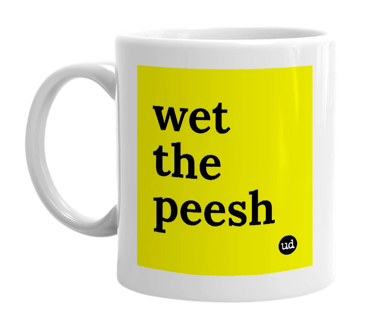 White mug with 'wet the peesh' in bold black letters