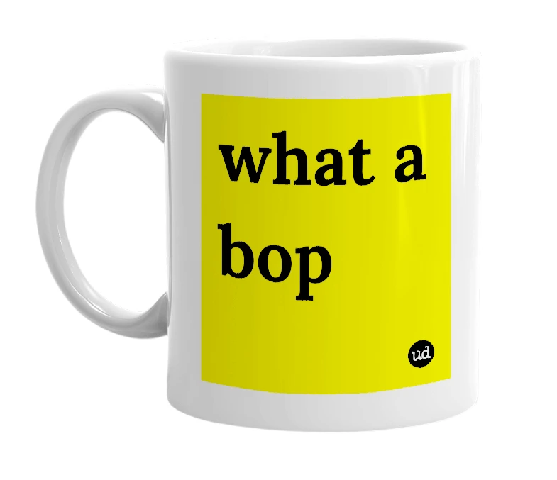 White mug with 'what a bop' in bold black letters