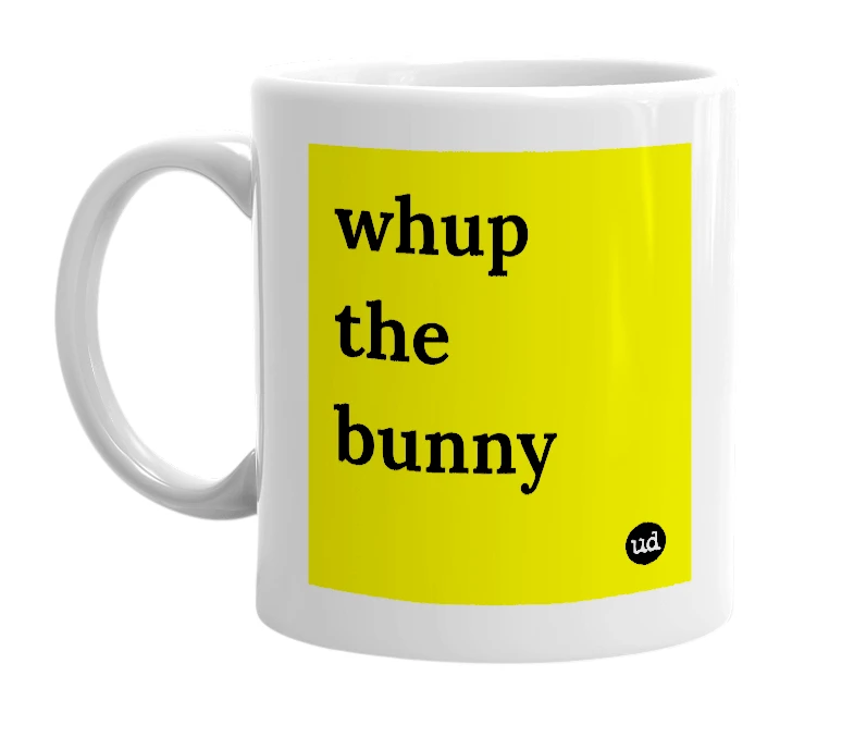 White mug with 'whup the bunny' in bold black letters