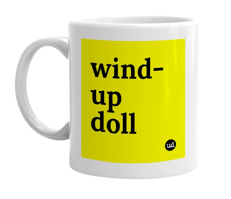 White mug with 'wind-up doll' in bold black letters