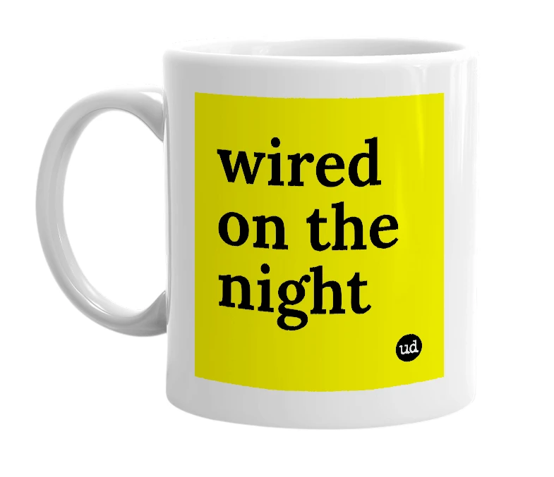 White mug with 'wired on the night' in bold black letters