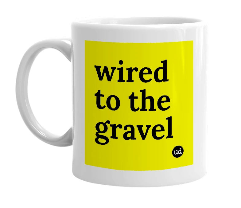 White mug with 'wired to the gravel' in bold black letters