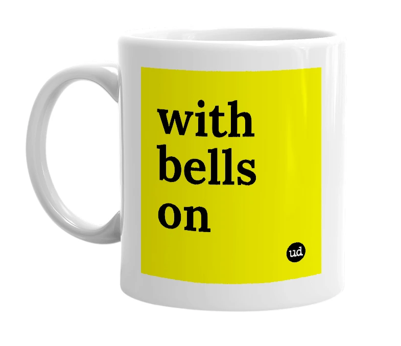 White mug with 'with bells on' in bold black letters