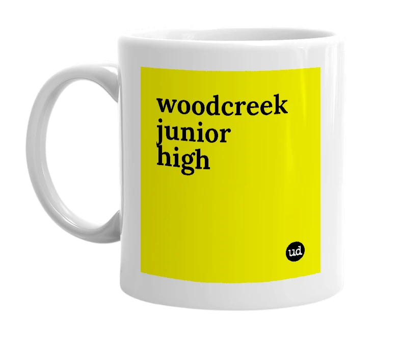 White mug with 'woodcreek junior high' in bold black letters