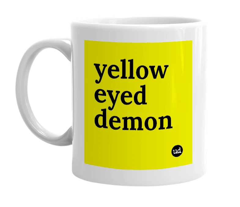 White mug with 'yellow eyed demon' in bold black letters