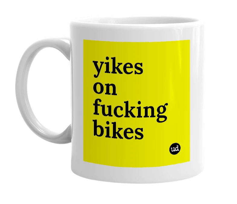 White mug with 'yikes on fucking bikes' in bold black letters