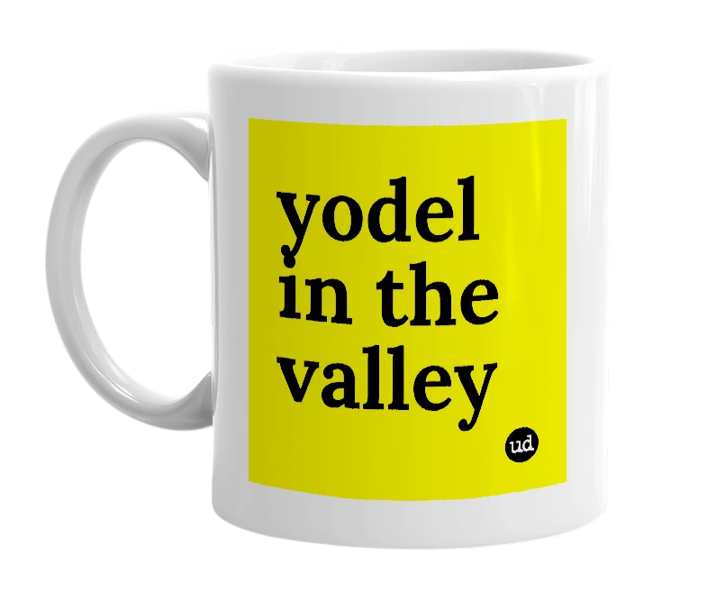 White mug with 'yodel in the valley' in bold black letters