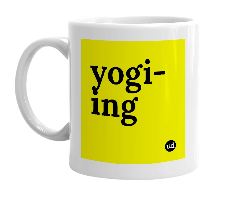 White mug with 'yogi-ing' in bold black letters