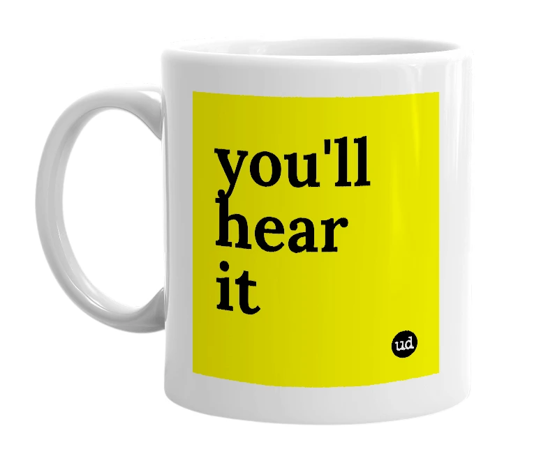 White mug with 'you'll hear it' in bold black letters