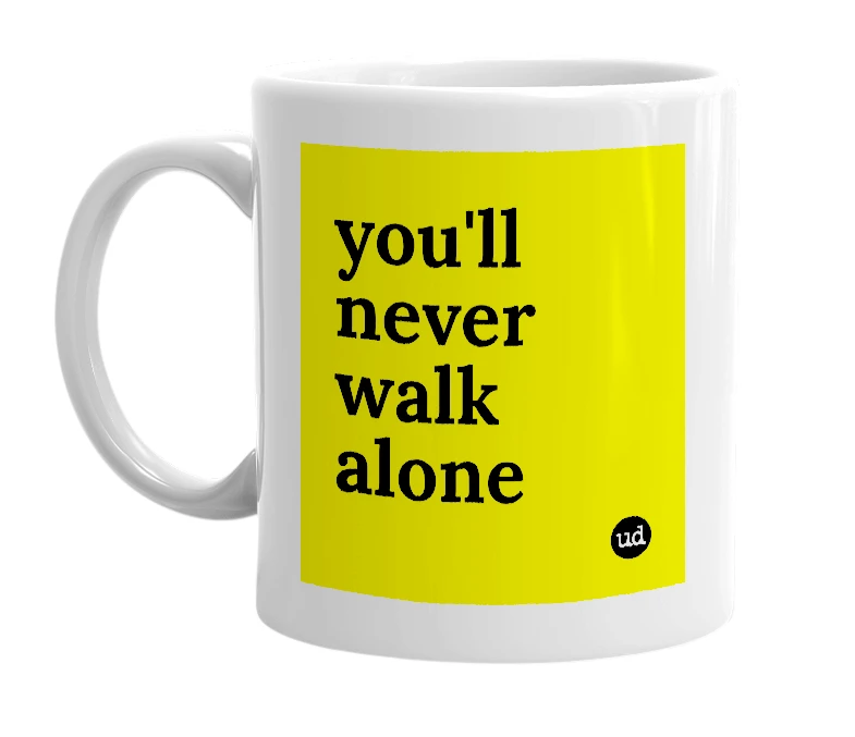 White mug with 'you'll never walk alone' in bold black letters