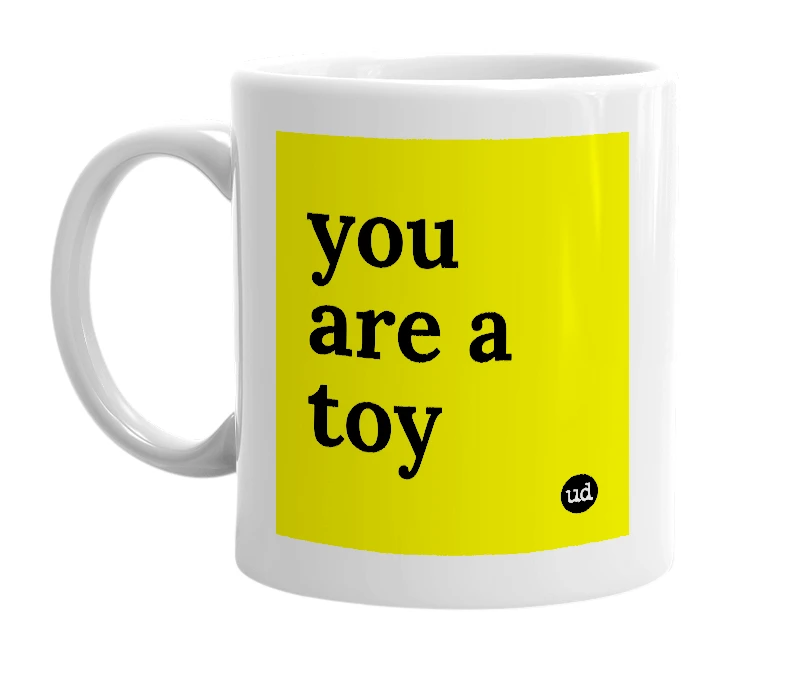White mug with 'you are a toy' in bold black letters