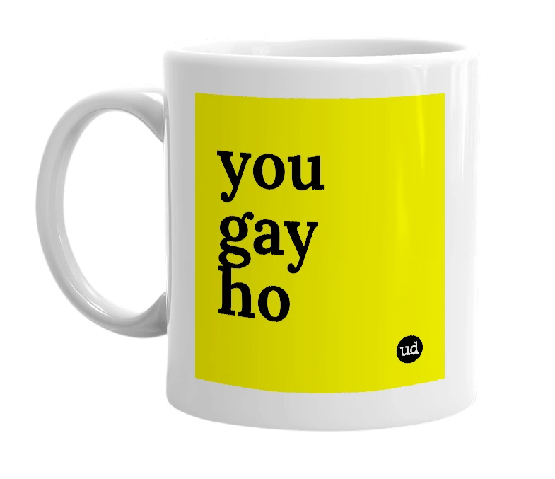 White mug with 'you gay ho' in bold black letters