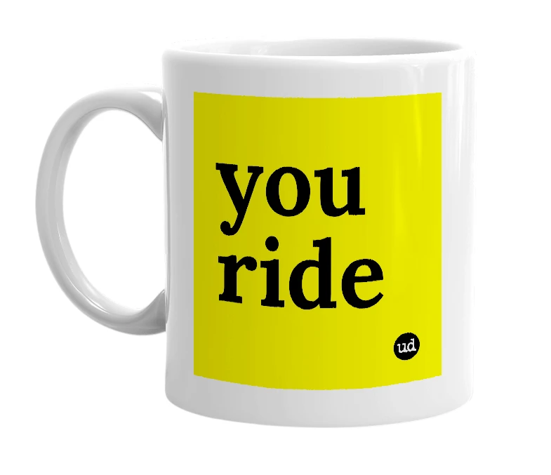 White mug with 'you ride' in bold black letters