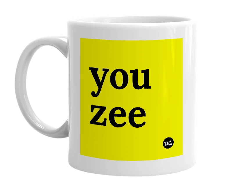White mug with 'you zee' in bold black letters