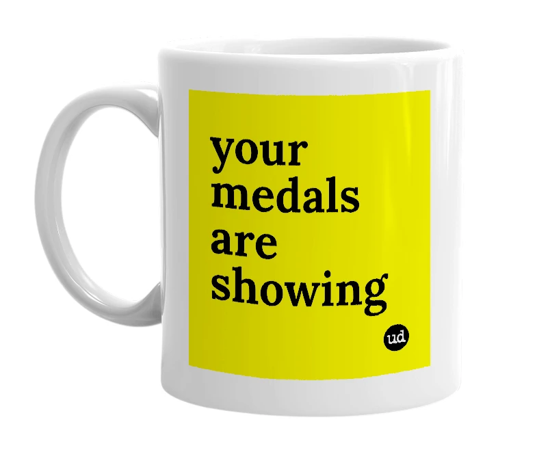 White mug with 'your medals are showing' in bold black letters