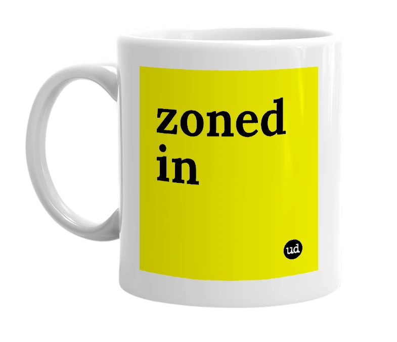 White mug with 'zoned in' in bold black letters